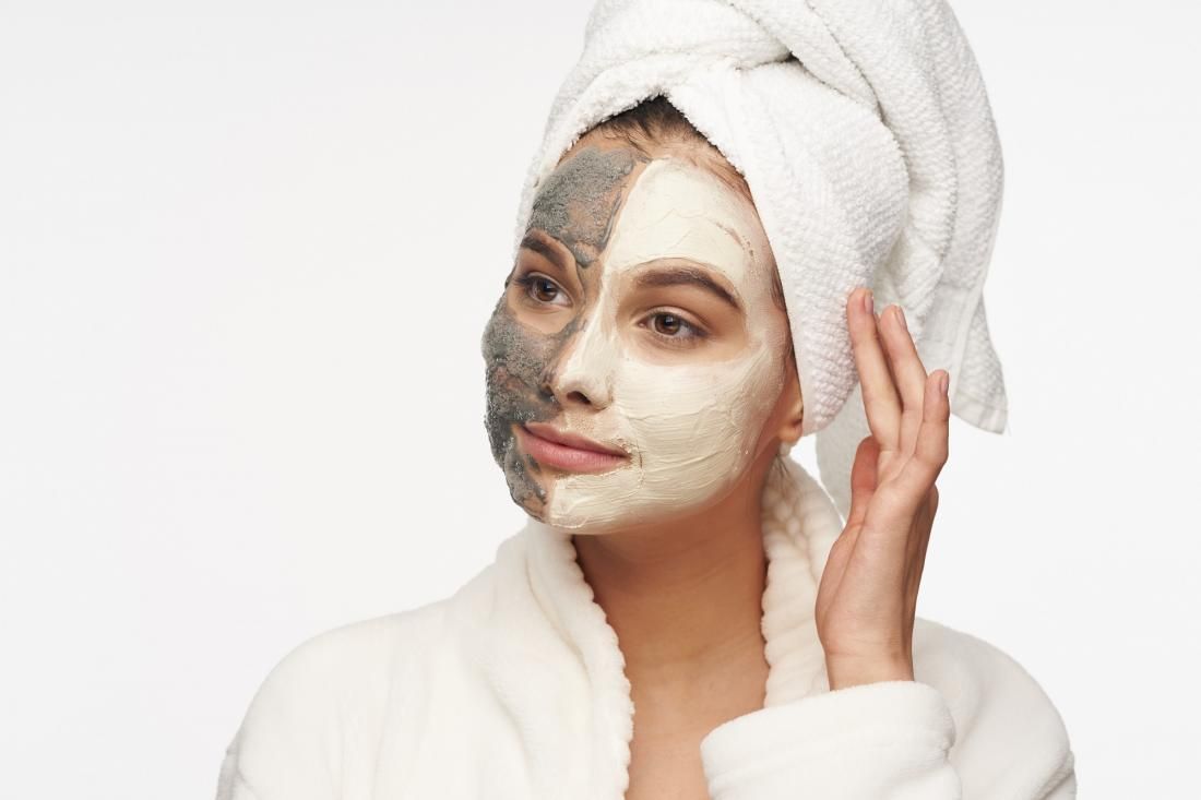 moisturizing face mask scrub cosmetics clean skin woman white coat with towel